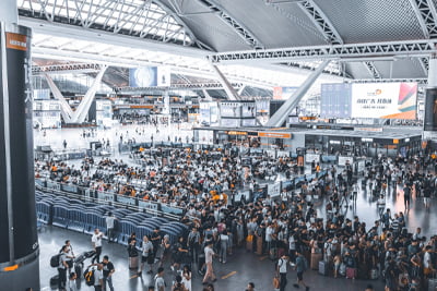 Picture of an airport with a lot of people